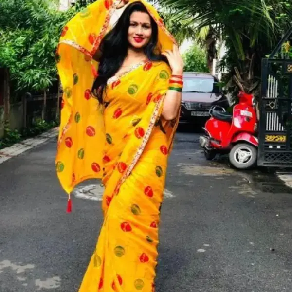 Yellow colored Matka Georgette Saree with Lace border and Blouse